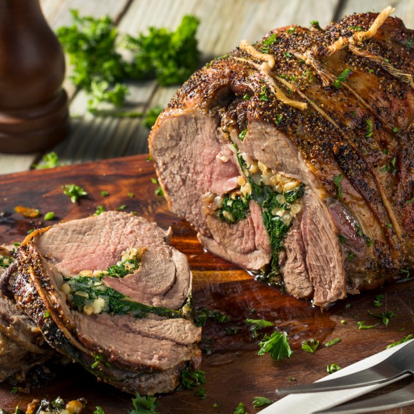 Holiday Stuffed Leg of Lamb with Herb and Pine Nut Stuffing and Rosemary Sauce