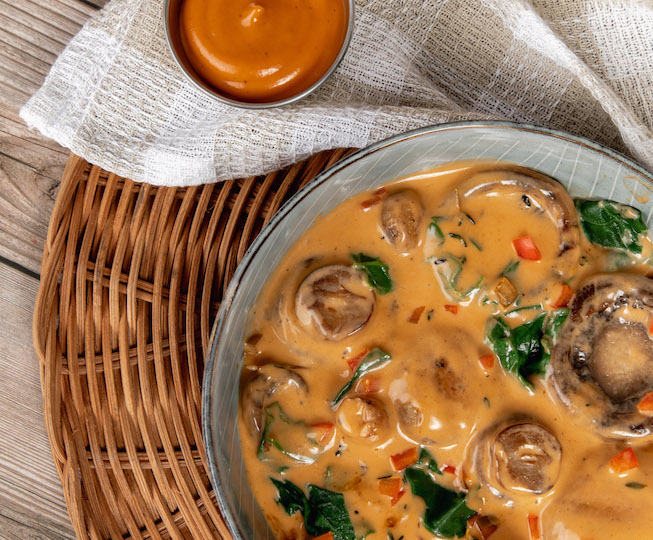 delicious mushrooms in red sauce